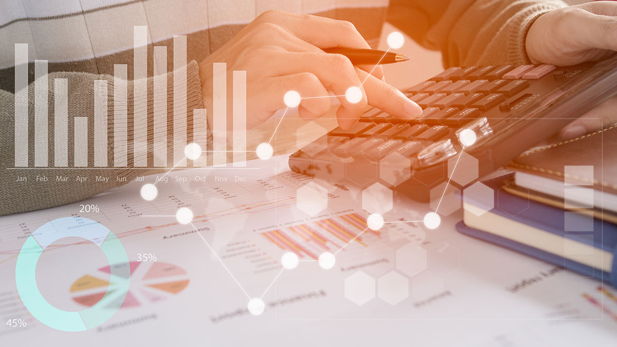 man working on finance sheets with data overlay